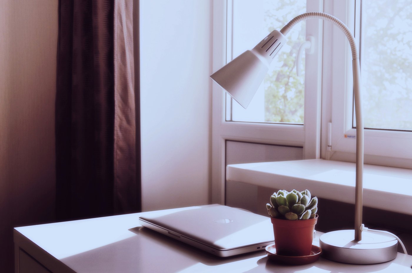 MacBook on a minimalist wooden desk