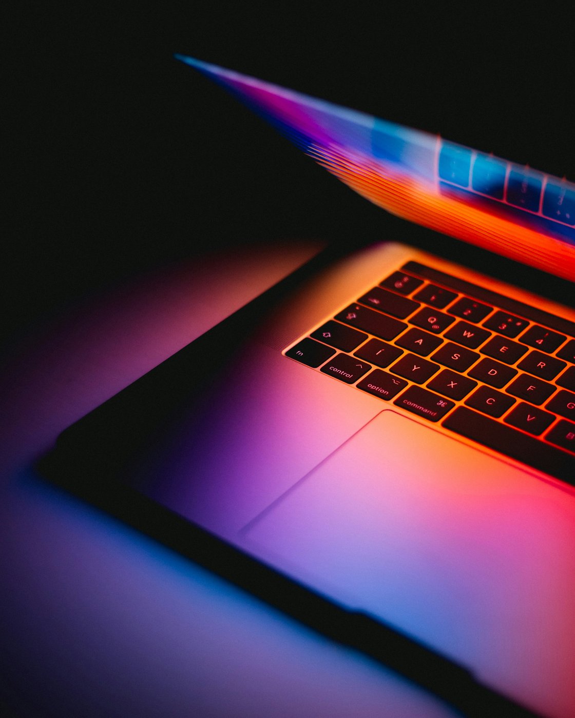 Laptop with gradient display in a dark room